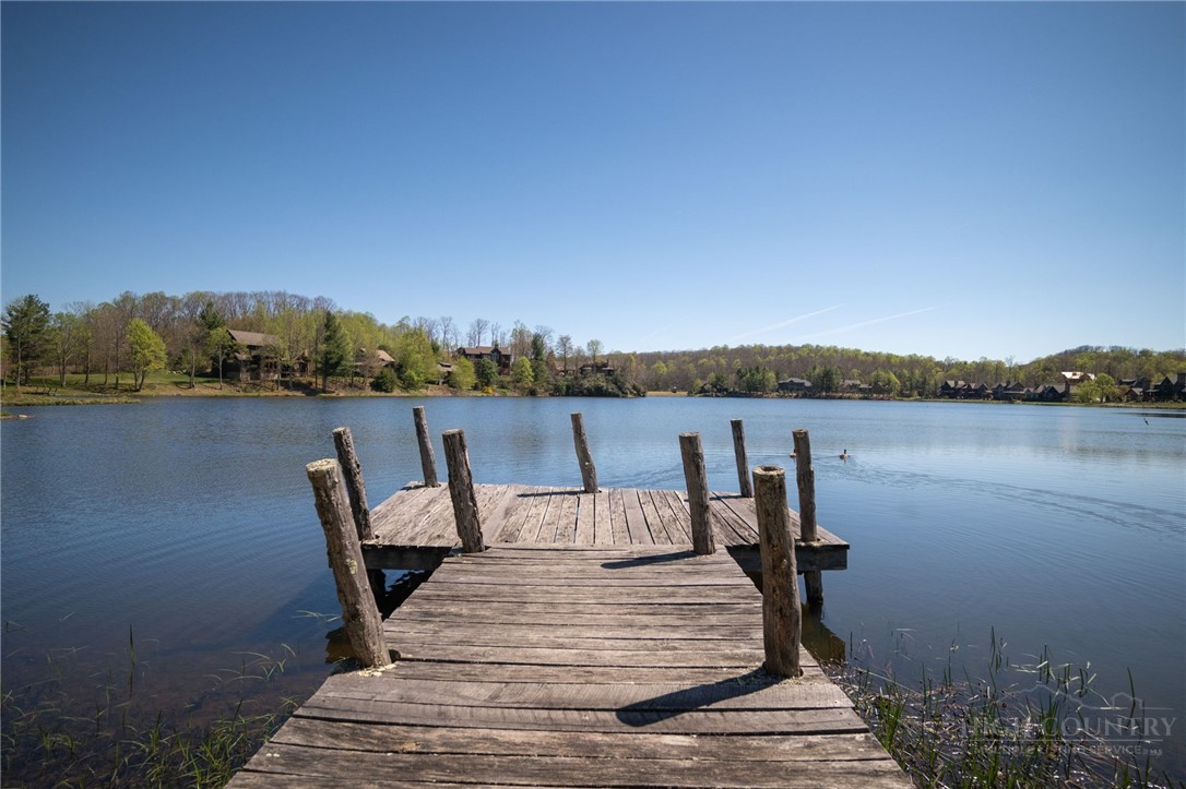 Owls Brow Ridge Blowing Rock, NC 28605 - Photo 21 of 32 a view of a lake with furniture