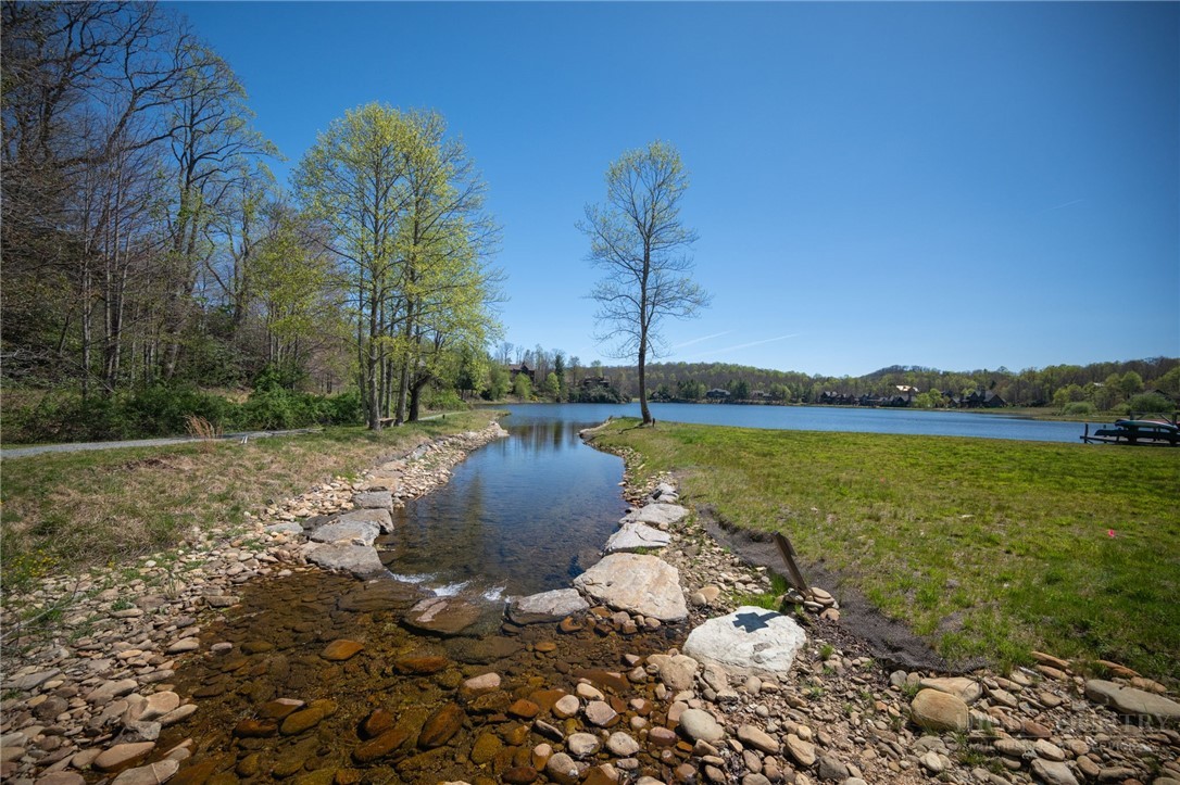 Owls Brow Ridge Blowing Rock, NC 28605 - Photo 25 of 32 a view of a lake with a yard