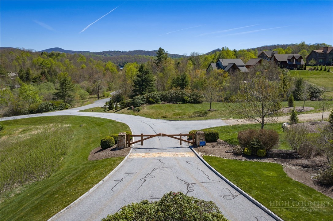 Owls Brow Ridge Blowing Rock, NC 28605 - Photo 8 of 32 a view of a street with a yard