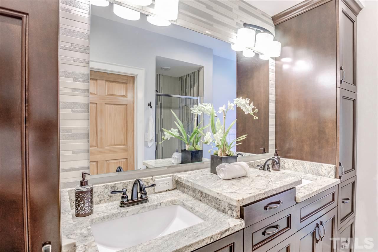 9554 Valley Road Middlesex, NC 27557 - Photo 16 of 30 a bathroom with a granite countertop sink and a mirror