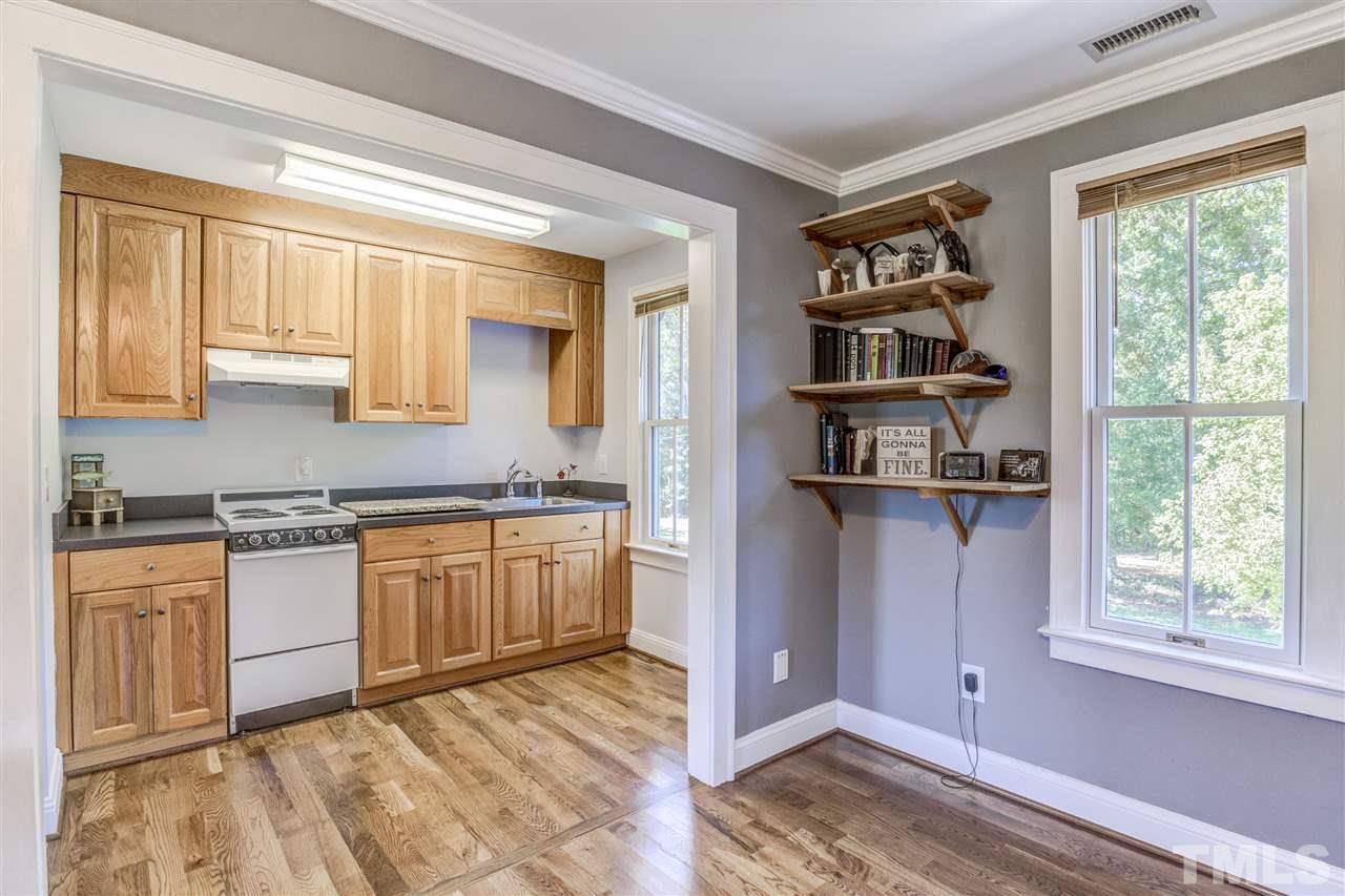9554 Valley Road Middlesex, NC 27557 - Photo 21 of 30 a kitchen with stainless steel appliances granite countertop a stove and a refrigerator