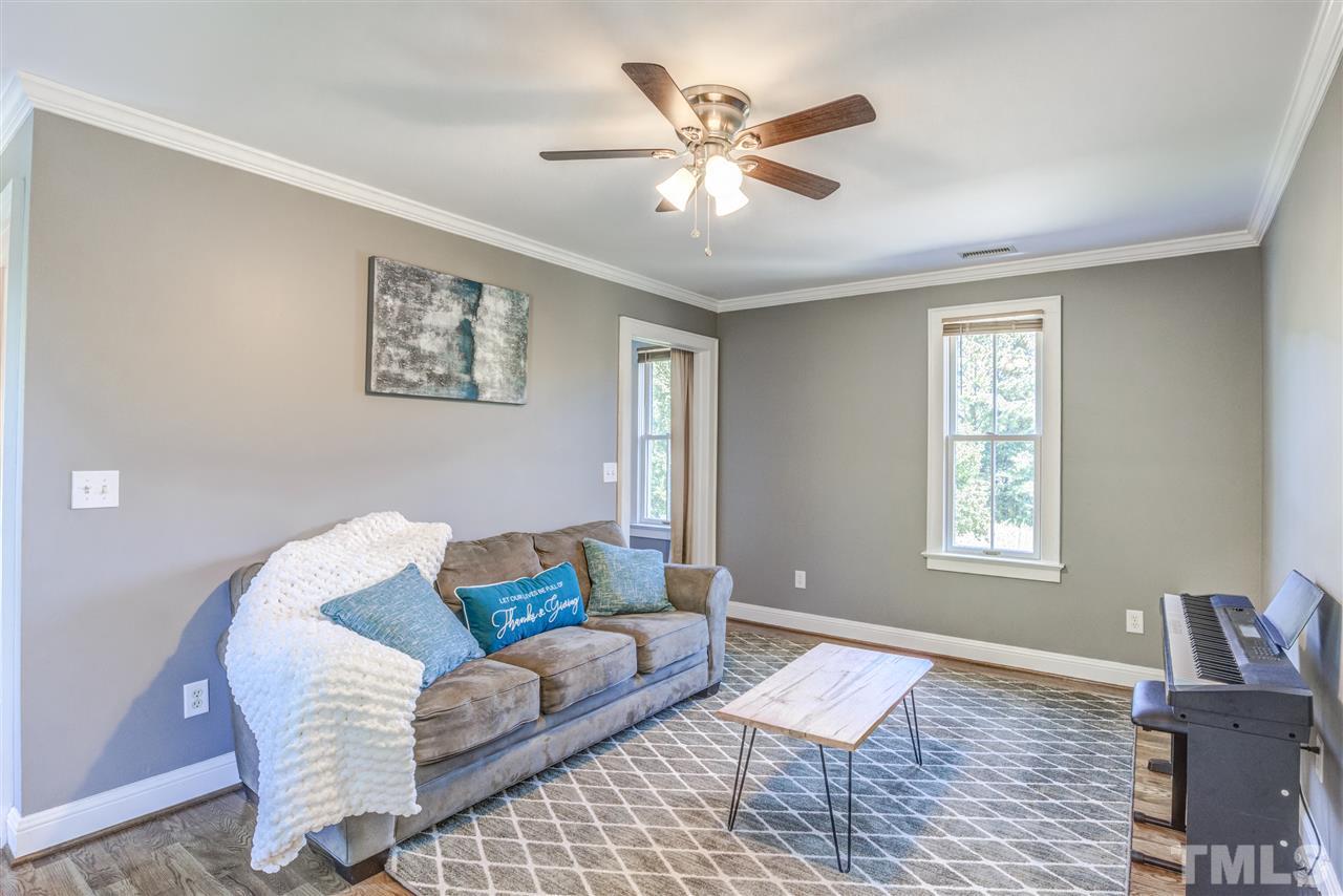 9554 Valley Road Middlesex, NC 27557 - Photo 22 of 30 a living room with furniture and a window