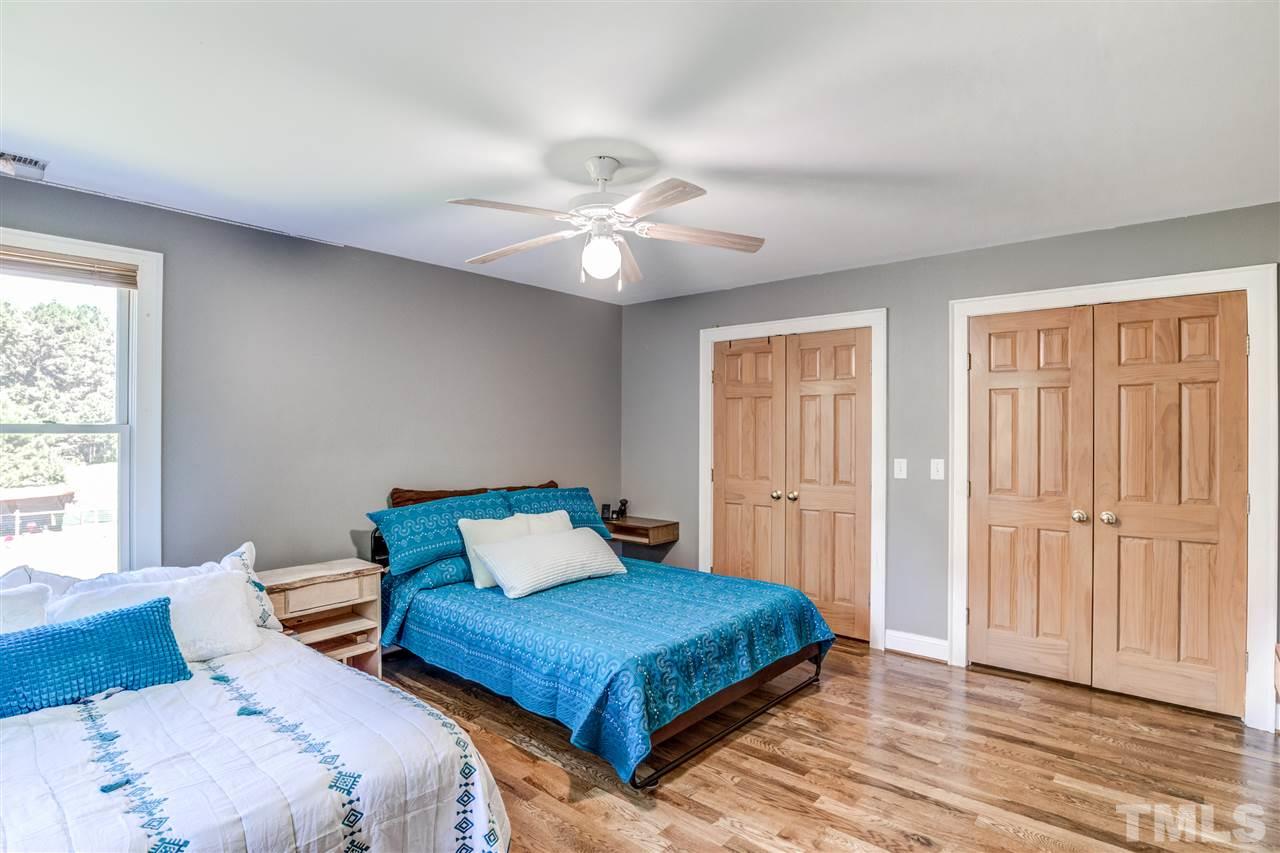 9554 Valley Road Middlesex, NC 27557 - Photo 25 of 30 a bedroom with a bed ceiling fan and a window