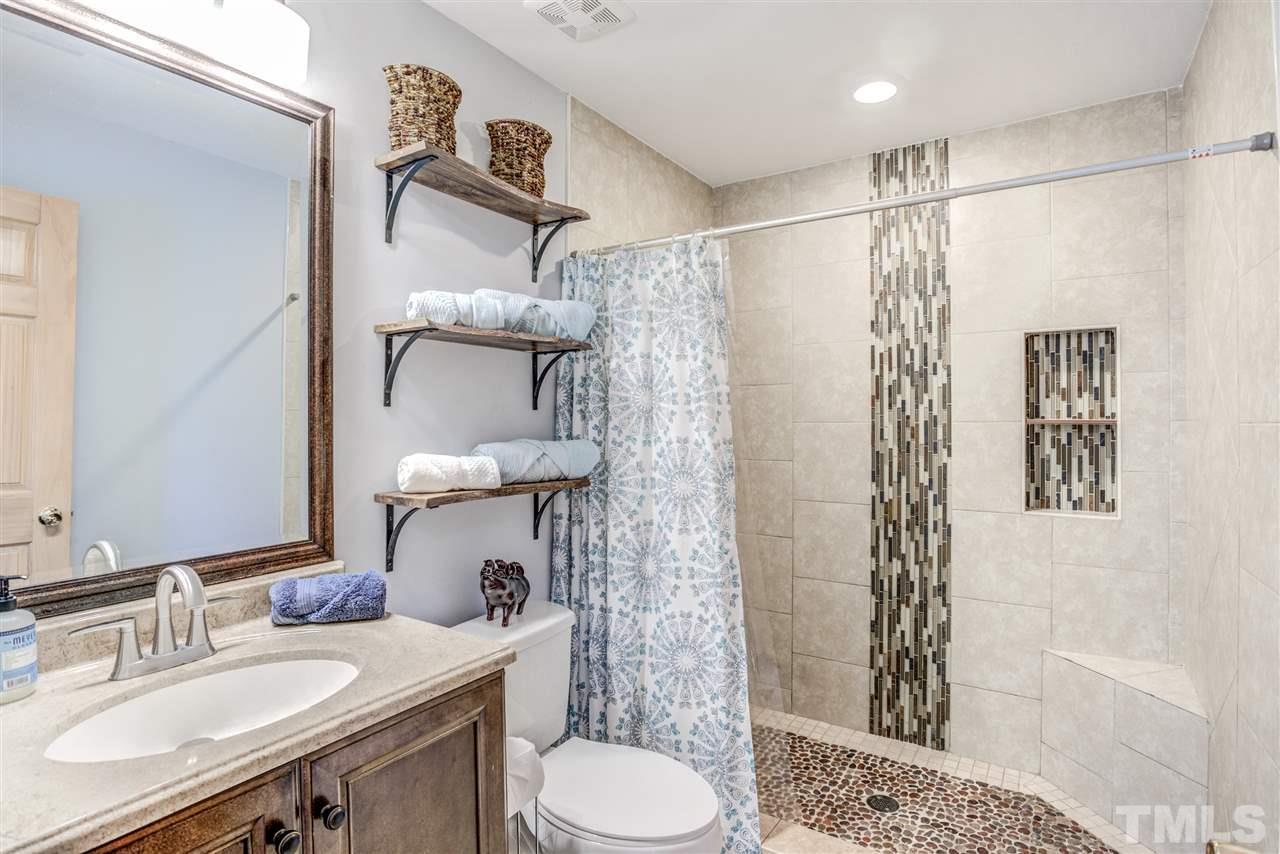 9554 Valley Road Middlesex, NC 27557 - Photo 26 of 30 a bathroom with a sink toilet and shower