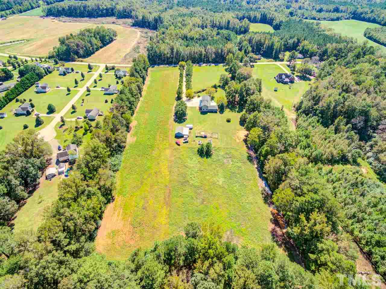 9554 Valley Road Middlesex, NC 27557 - Photo 30 of 30 a view of a lake with a yard