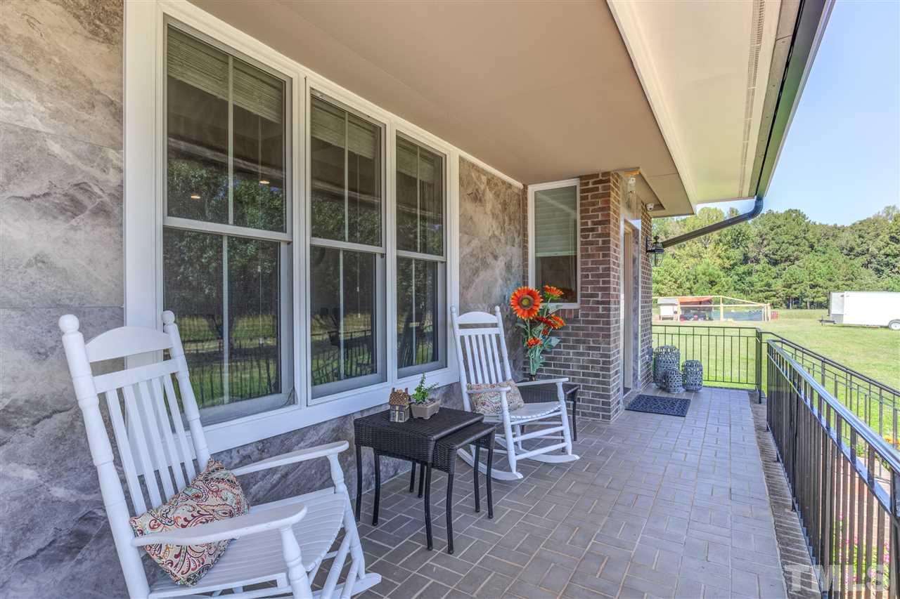 9554 Valley Road Middlesex, NC 27557 - Photo 4 of 30 a view of a chairs and table in the balcony