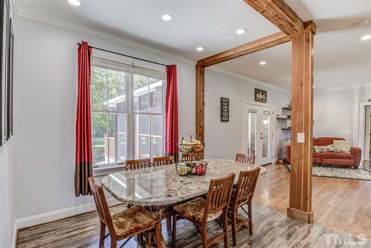 9554 Valley Road Middlesex, NC 27557 - Photo 7 of 30 a view of a a dining room with furniture window and wooden floor