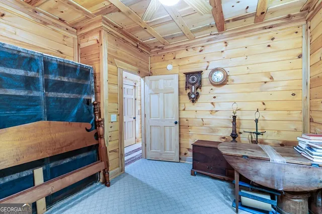 a bathroom with a toilet and a shower curtain