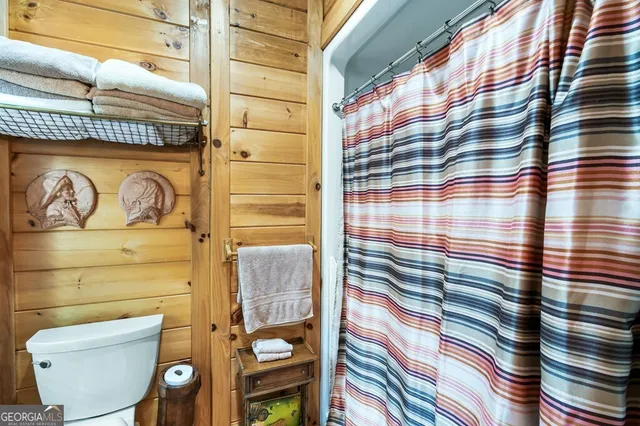 a view of a deck with a backyard