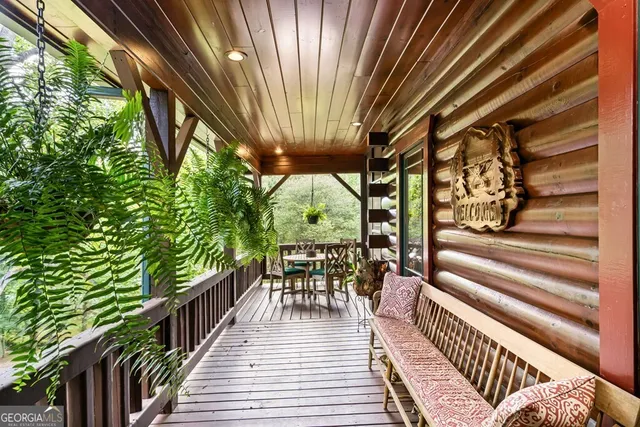 an aerial view of residential house with outdoor space and swimming pool