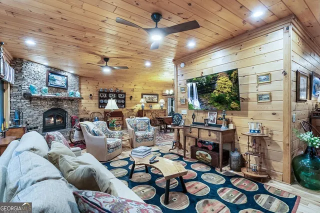 a living room with furniture a fireplace and a table