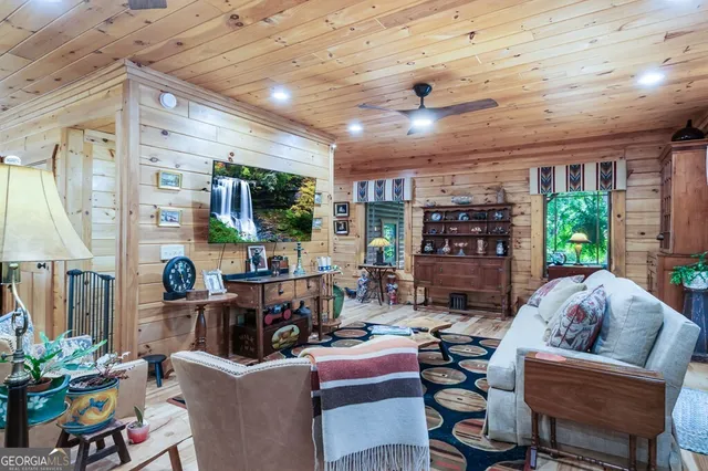 a kitchen with stainless steel appliances granite countertop a stove a sink dishwasher and cabinets with wooden floor