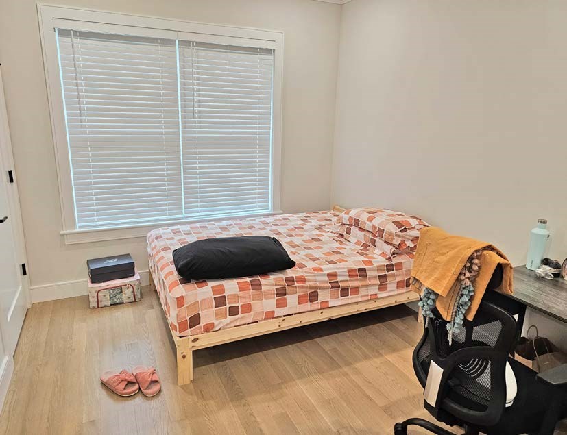 13 Greylock Road Boston, MA 02134 - Photo 13 of 17 a bedroom with a bed and a window