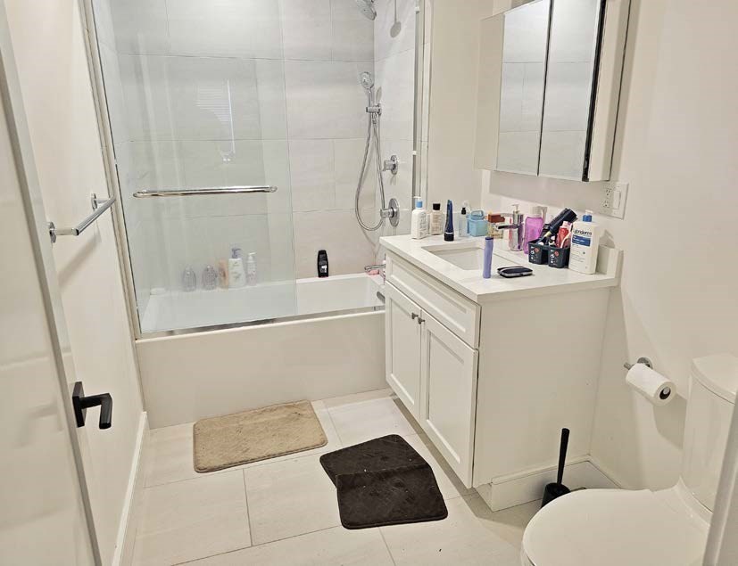 13 Greylock Road Boston, MA 02134 - Photo 14 of 17 a bathroom with a sink mirror vanity and toilet