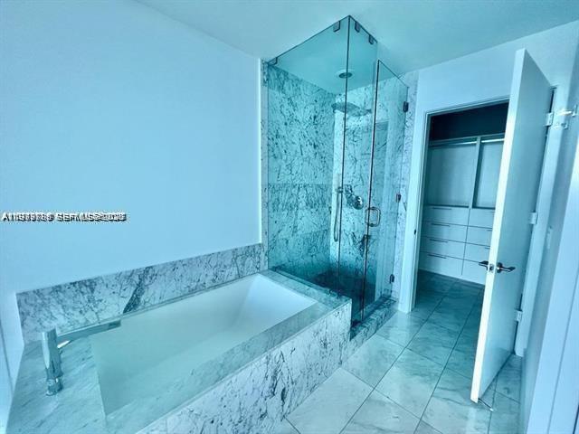 480 Northeast 31st Street, Unit 902 Miami, FL 33137 - Photo 16 of 33 a bathroom with a shower and a sink