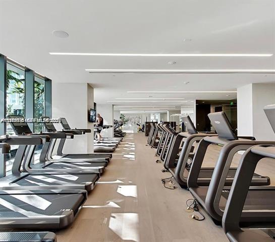 480 Northeast 31st Street, Unit 902 Miami, FL 33137 - Photo 22 of 33 a view of a gym with lots of gym equipment