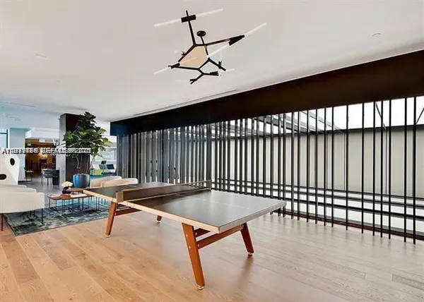 a living room with lots of furniture and a chandelier