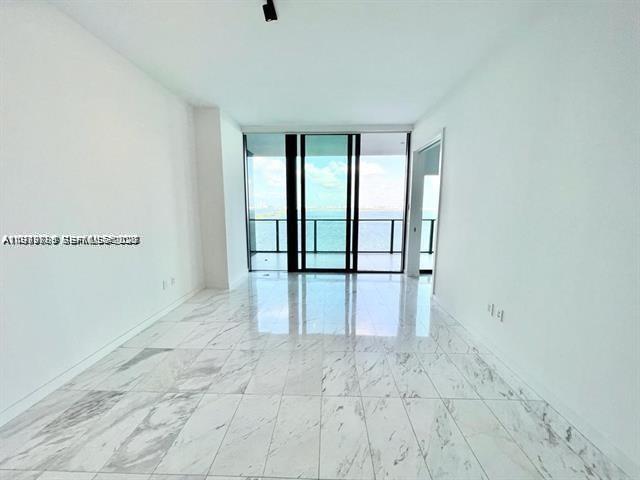 480 Northeast 31st Street, Unit 902 Miami, FL 33137 - Photo 8 of 33 a view of an empty room with a window