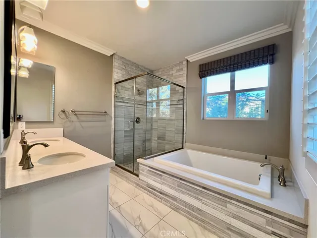 a bathroom with a bathtub and a sink