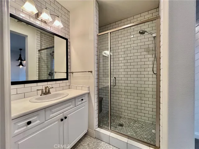 a bathroom with a sink toilet and mirror
