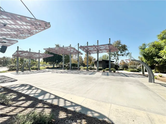 a view of a yard with plants and trees