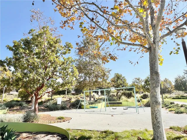 a view of a big yard with an trees