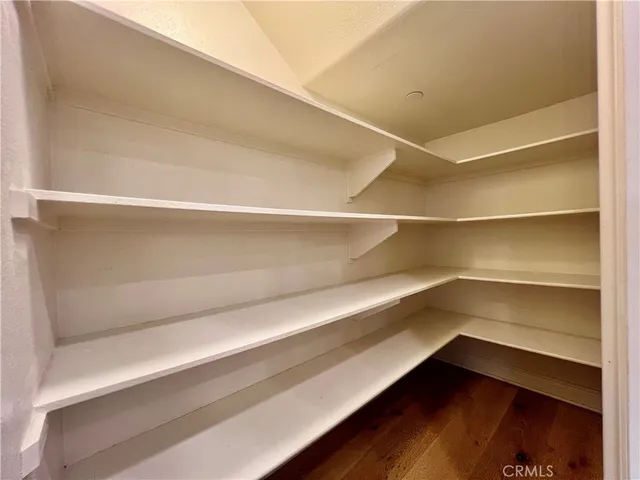 a storage room with wooden floor