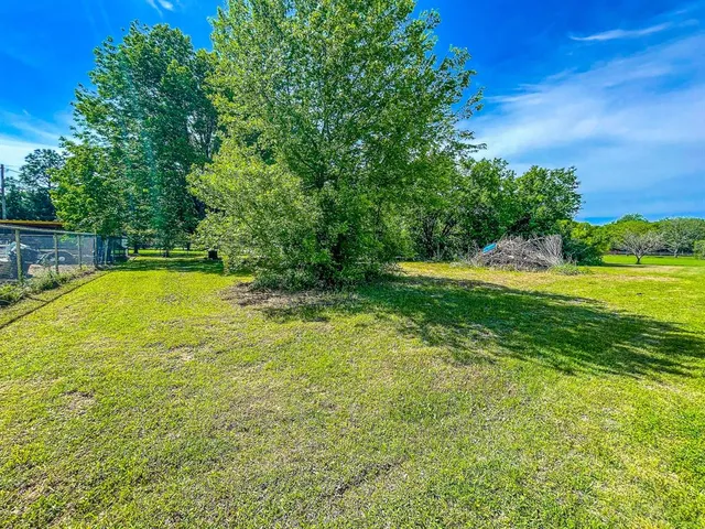 a view of a swimming pool with an outdoor space and seating area