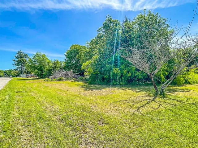 a view of a swimming pool with an outdoor space and seating area