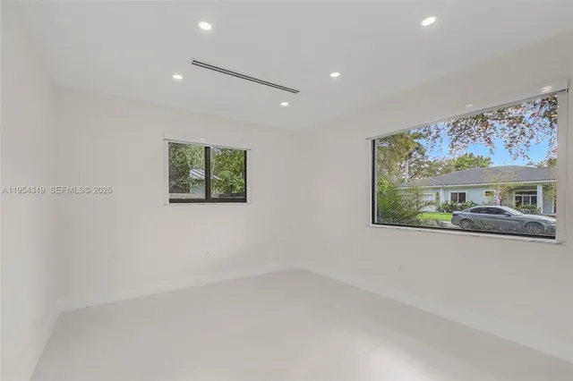 an empty room with windows