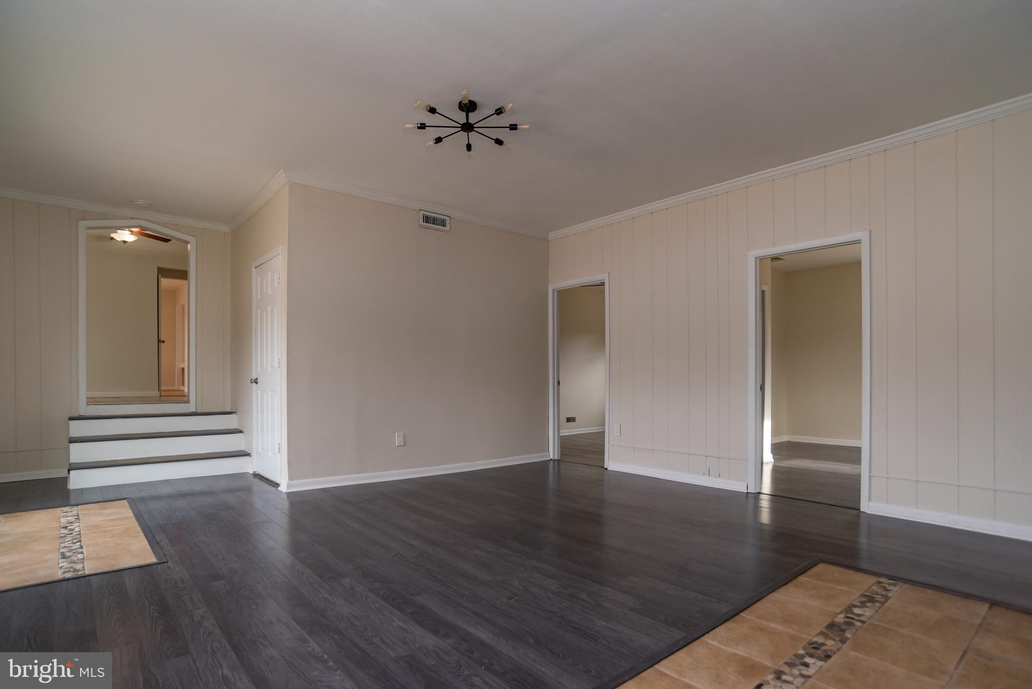2427 Buttonwood Lane Millville, NJ 08332 - Photo 14 of 58 a view of an empty room with wooden floor and closet