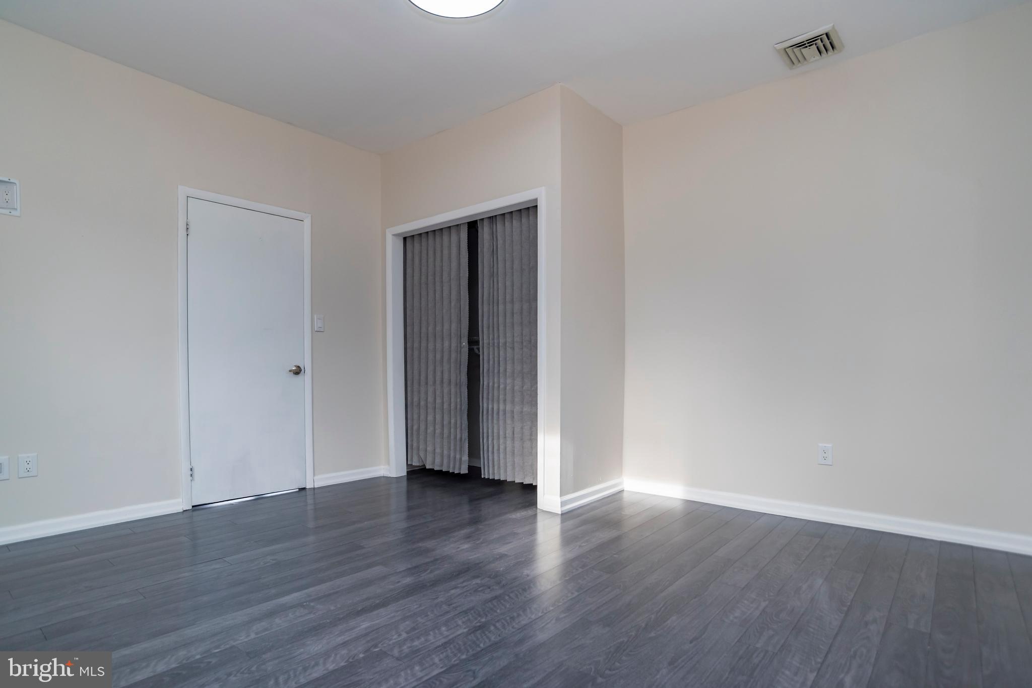 2427 Buttonwood Lane Millville, NJ 08332 - Photo 20 of 58 a view of an empty room with wooden floor