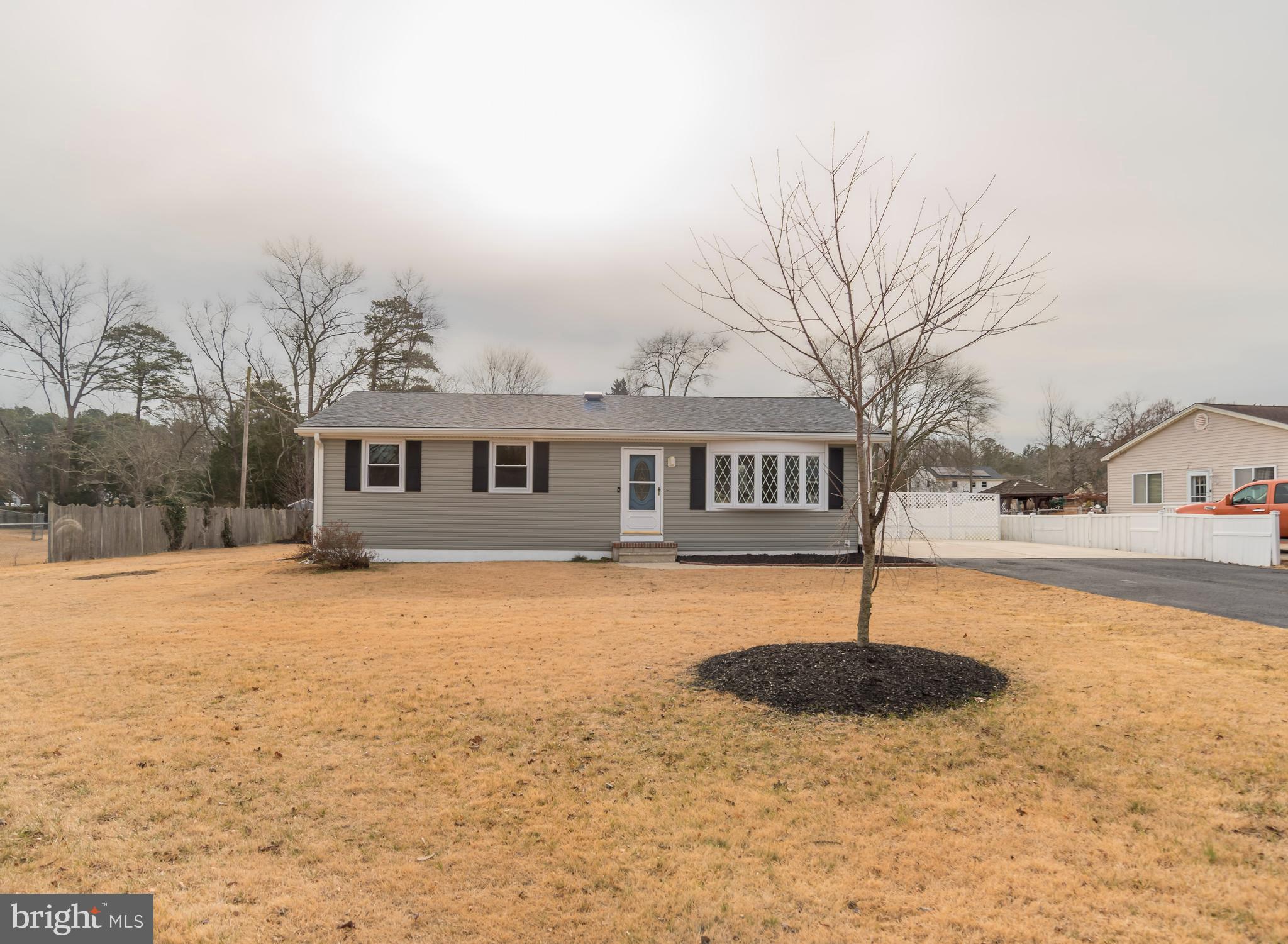 2427 Buttonwood Lane Millville, NJ 08332 - Photo 2 of 58 a front view of a house with a yard