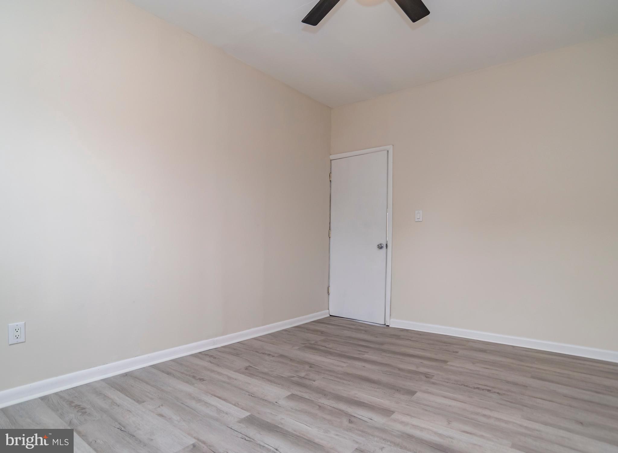 2427 Buttonwood Lane Millville, NJ 08332 - Photo 24 of 58 a view of an empty room with wooden floor