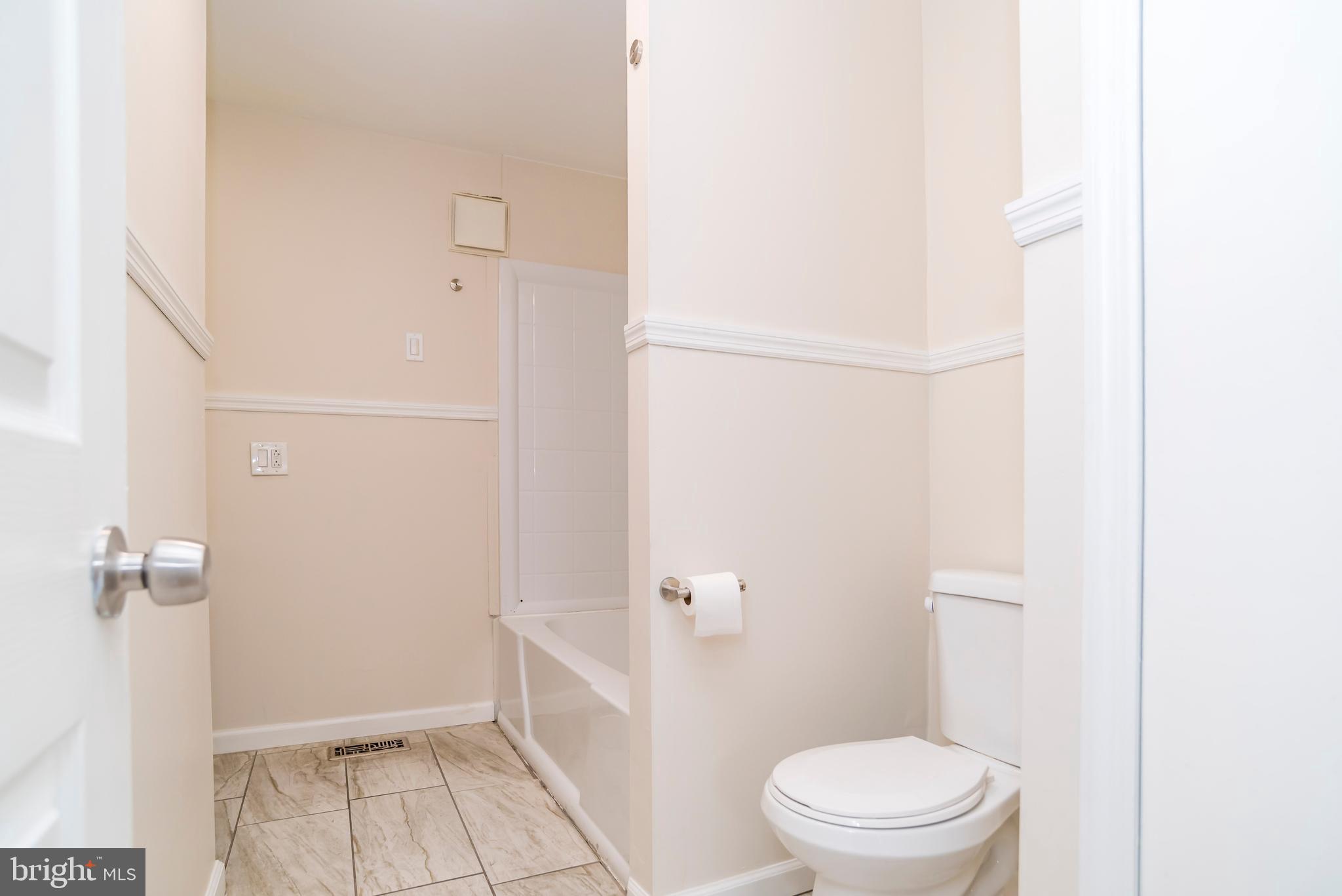 2427 Buttonwood Lane Millville, NJ 08332 - Photo 28 of 58 a bathroom with a granite countertop toilet and a shower