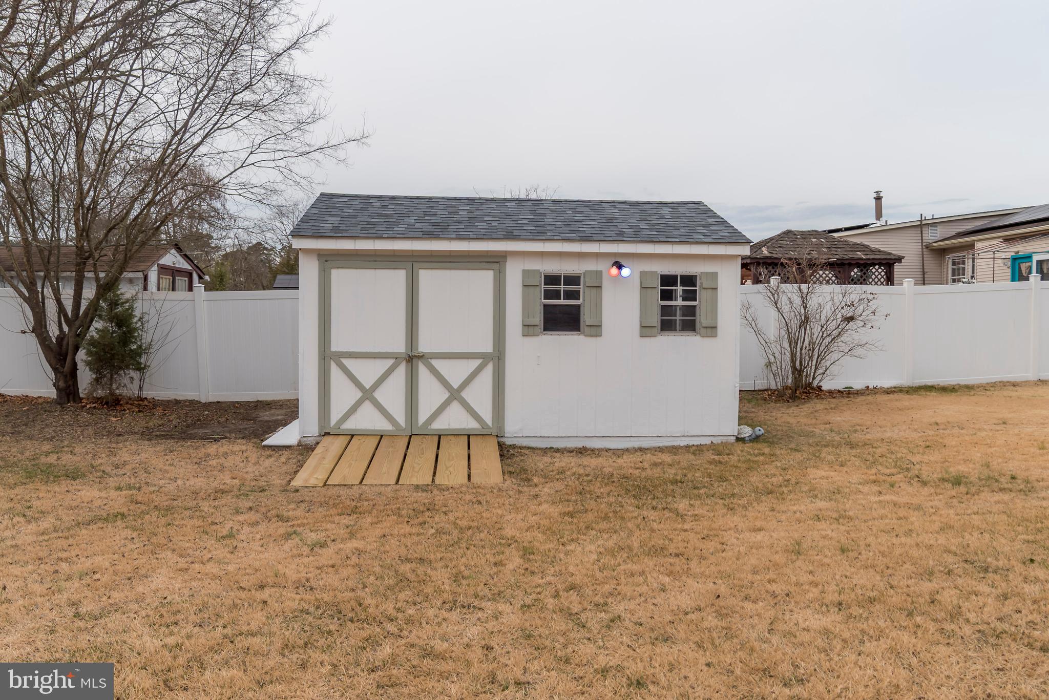 2427 Buttonwood Lane Millville, NJ 08332 - Photo 58 of 58 a backyard of a house with table and chairs