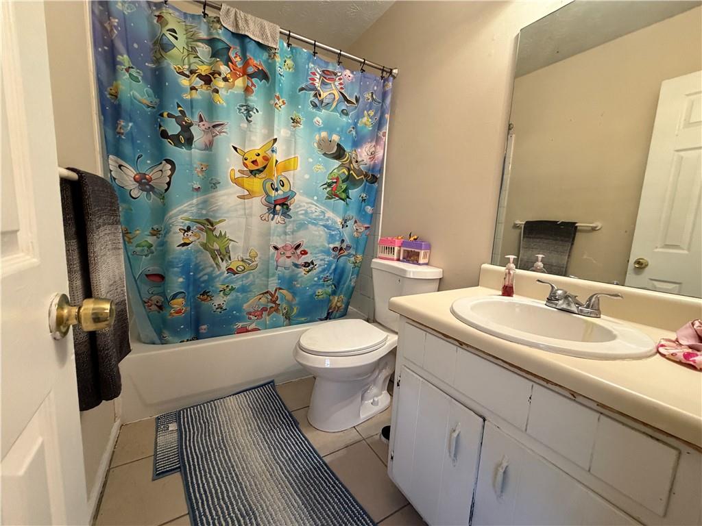 310 Bedford Bay Lane Lawrenceville, GA 30046 - Photo 13 of 23 a bathroom with a sink and a mirror