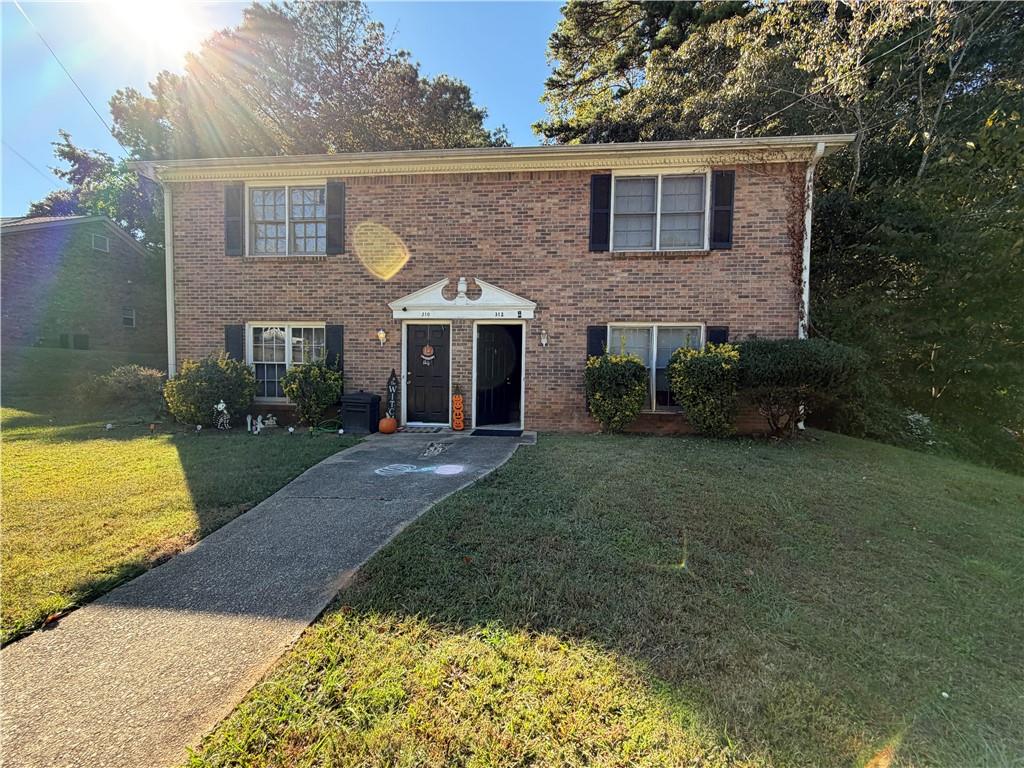 310 Bedford Bay Lane Lawrenceville, GA 30046 - Photo 5 of 23 a front view of a house with garden