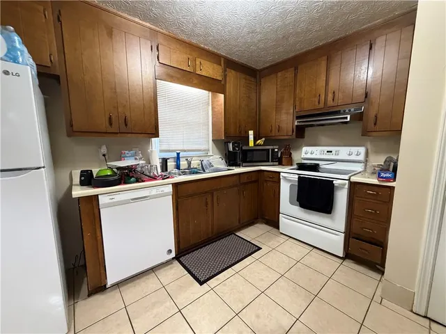 a sink sitting next to a bathroom sink