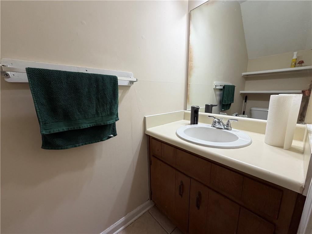 310 Bedford Bay Lane Lawrenceville, GA 30046 - Photo 9 of 23 a sink sitting next to a bathroom sink