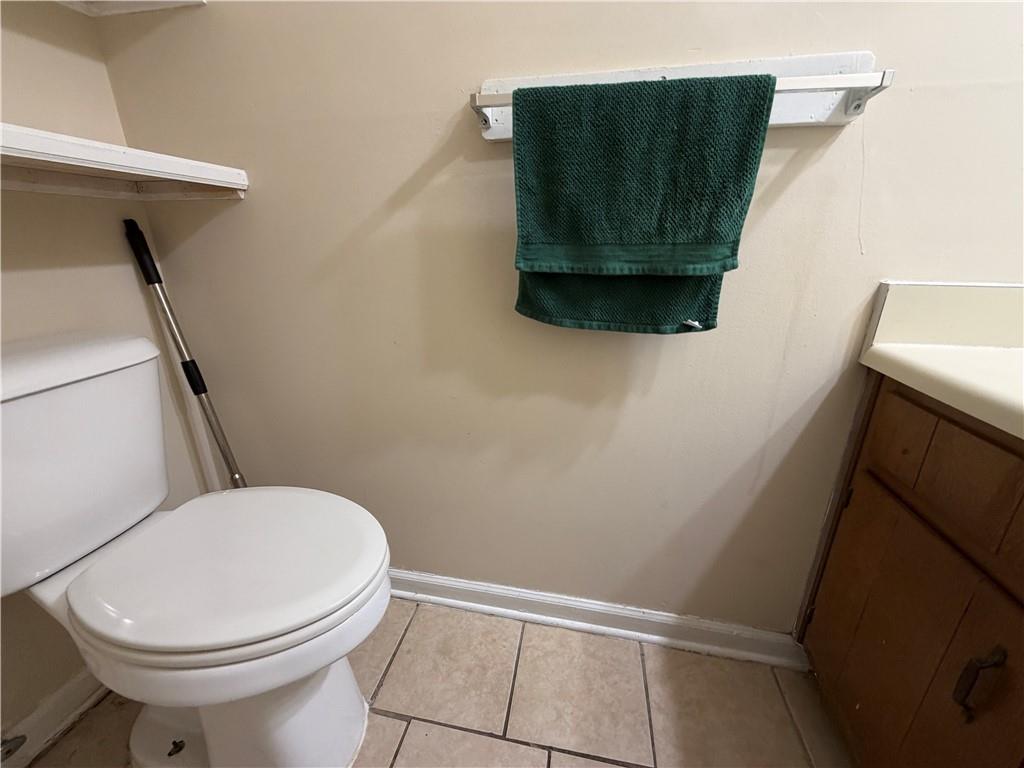 310 Bedford Bay Lane Lawrenceville, GA 30046 - Photo 10 of 23 a bathroom with a toilet and a sink