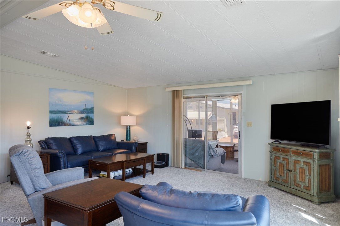 15 Ilex Street Alva, FL 33920 - Photo 11 of 43 a living room with furniture and a flat screen tv