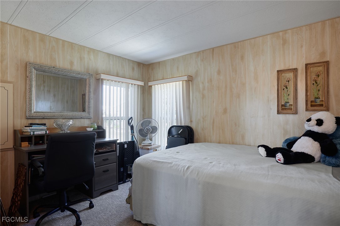 15 Ilex Street Alva, FL 33920 - Photo 18 of 43 a bedroom with a bed and a dresser