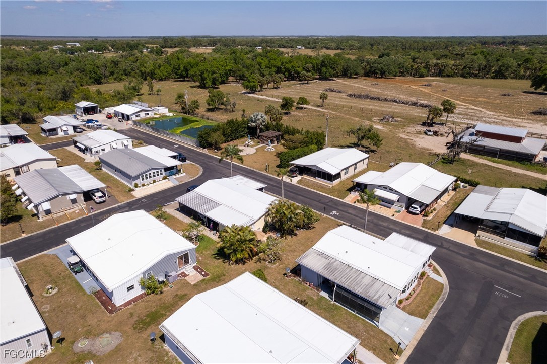 15 Ilex Street Alva, FL 33920 - Photo 27 of 43 an aerial view of a city with lots of residential buildings and mountain view in back