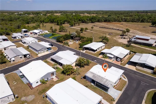 an aerial view of a house with outdoor space