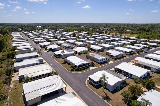 an aerial view of a house with a lake view