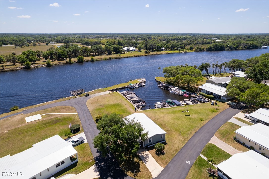 15 Ilex Street Alva, FL 33920 - Photo 40 of 43 an aerial view of a house with a lake view