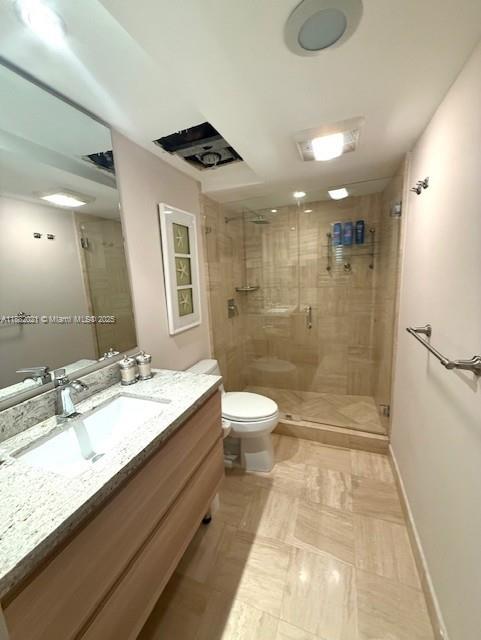 1121 Crandon Boulevard, Unit D702 Key Biscayne, FL 33149 - Photo 12 of 51 a bathroom with a granite countertop sink a toilet a mirror and shower