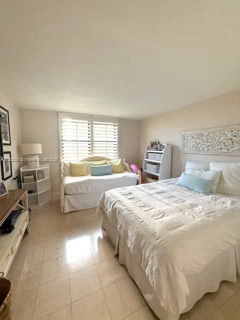 1121 Crandon Boulevard, Unit D702 Key Biscayne, FL 33149 - Photo 13 of 51 a bedroom with a bed and a window
