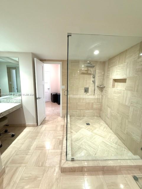 1121 Crandon Boulevard, Unit D702 Key Biscayne, FL 33149 - Photo 14 of 51 a bathroom with a bathtub shower sink and mirror